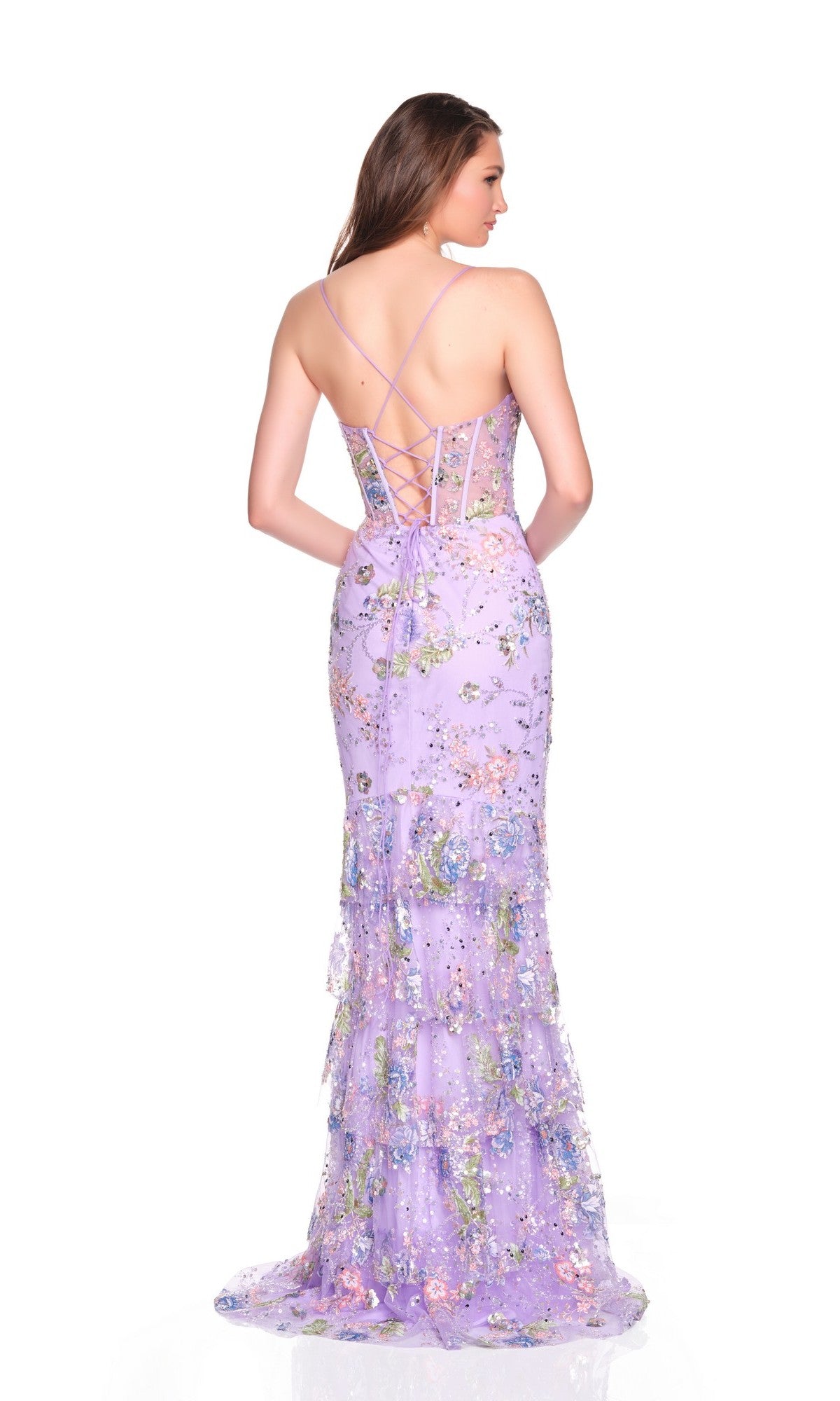 A woman stands against a white background wearing the Dave and Johnny 12785 long prom dress, a sleeveless purple gown featuring floral motifs and a lace-up corset bodice.